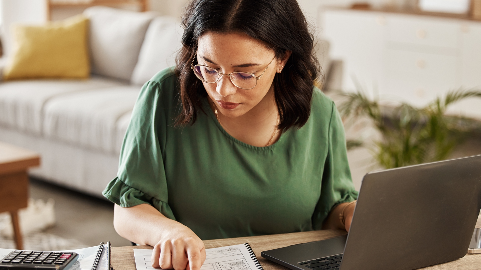 woman with laptop in home office